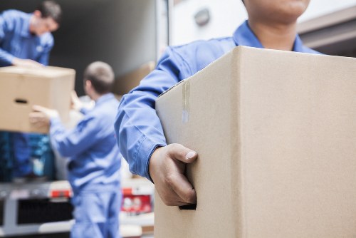 Removal van and packed boxes for a house move in Queens Park