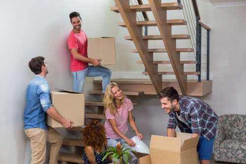 Furniture pick-up service handling bulky items in a Queens Park home