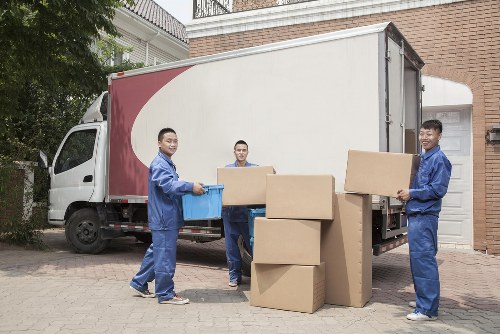 Student removals team handling boxes and furniture in Queens Park