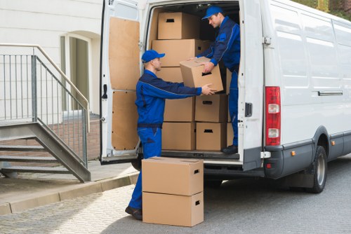 Removalists loading furniture for a house move in Queens Park