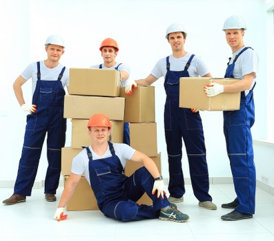 Professional movers handling furniture and household items carefully