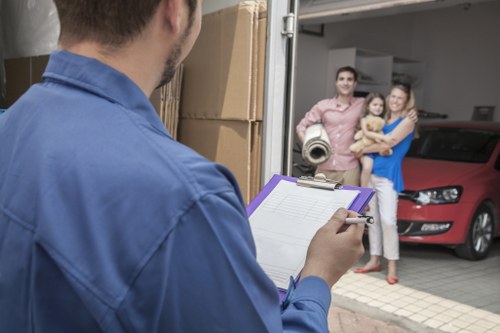 Moving team loading belongings during a local Queens Park relocation