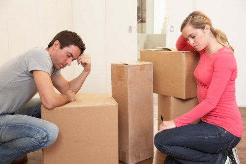 Local moving team handling boxes and household items in Queens Park