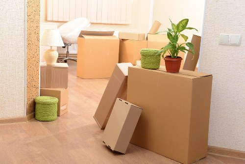Professional movers handling a flat relocation near Queens Park