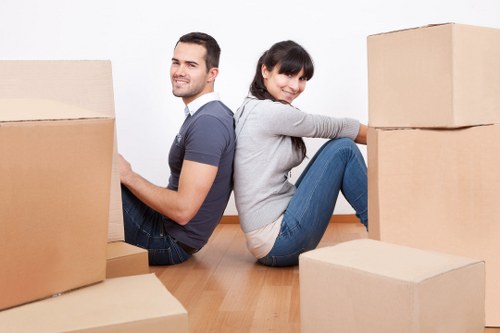 Careful handling of household items during a Queens Park removal