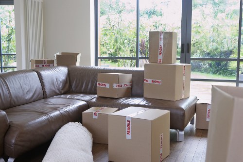 Local movers loading a van for a Queens Park relocation
